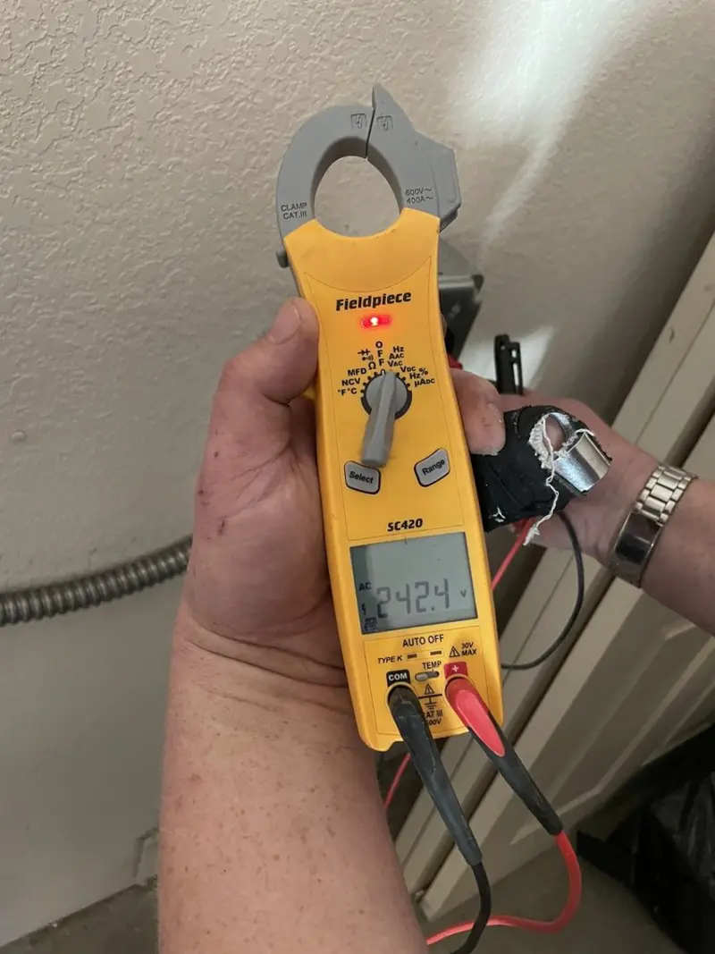 Voltage testing with clamp meter during Whole House Surge Protector in Valencia West